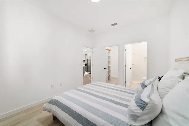 a bedroom with a bed and a table