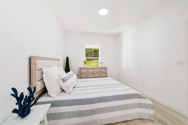 a bedroom with a bed and window