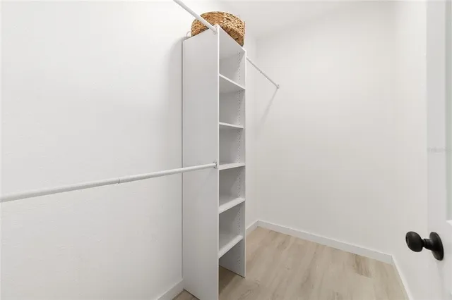 a view of an empty walk in closet