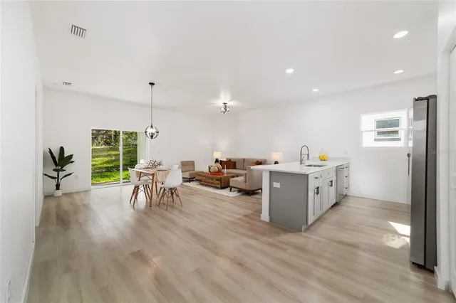 a view of a kitchen with furniture and a window