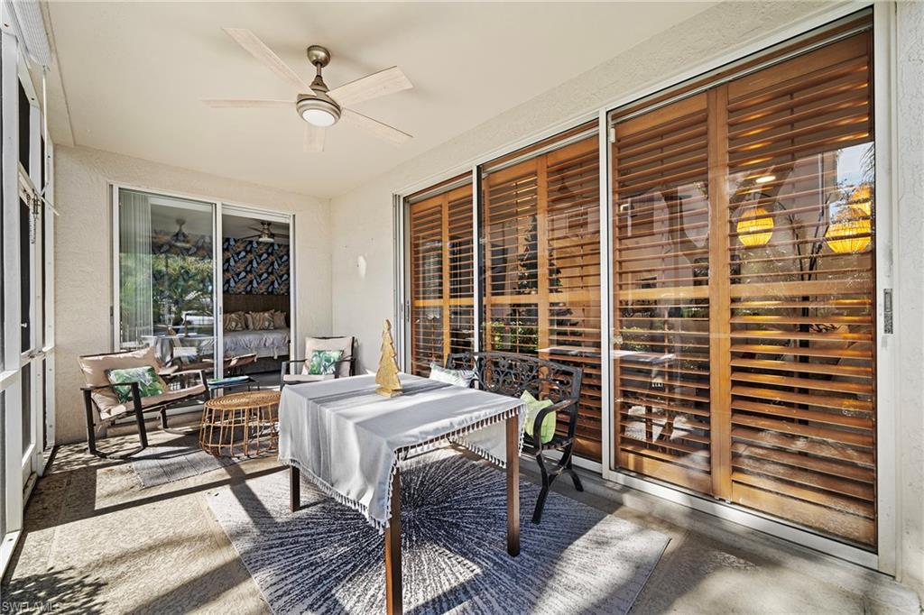 3780 Fieldstone Boulevard, Unit 301 Naples, FL 34109 - Photo 16 of 35 a view of a dining room with furniture window and outside view