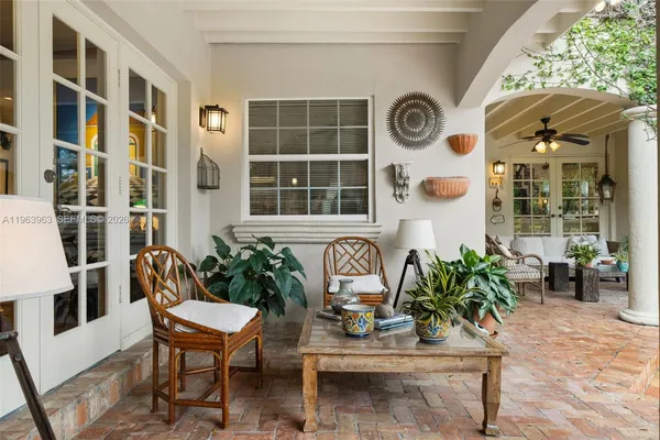 a swimming pool with barbeque oven in front of it