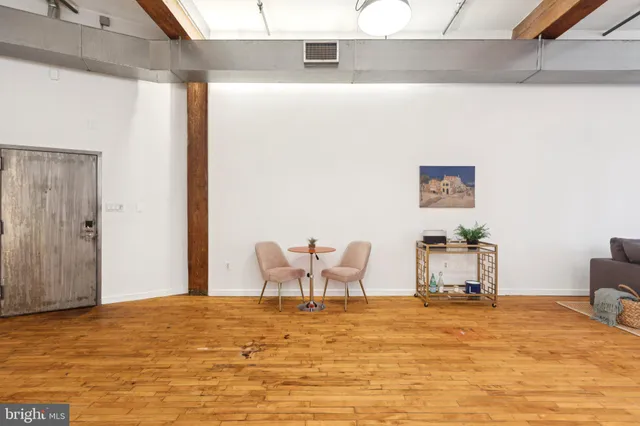 a bedroom with a bed and chair