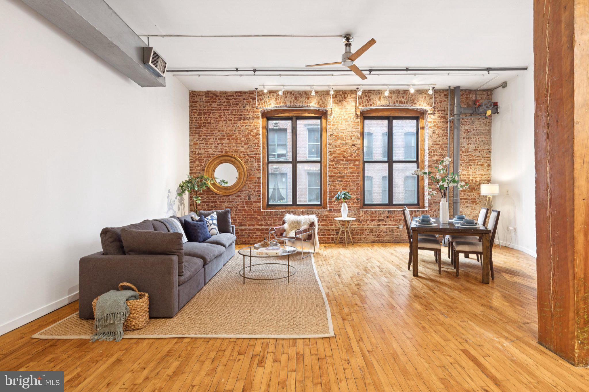 428 North 13th Street, Unit 3E Philadelphia, PA 19123 - Photo 2 of 44 a living room with furniture and wooden floor