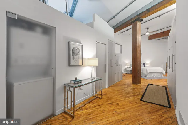 a bedroom with a bed and a view of bathroom