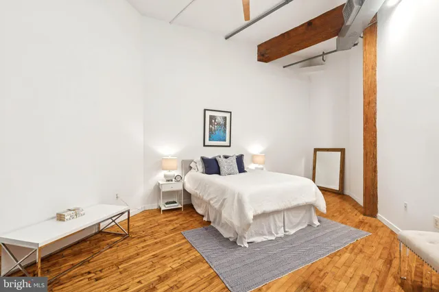 a bedroom with a bed and window