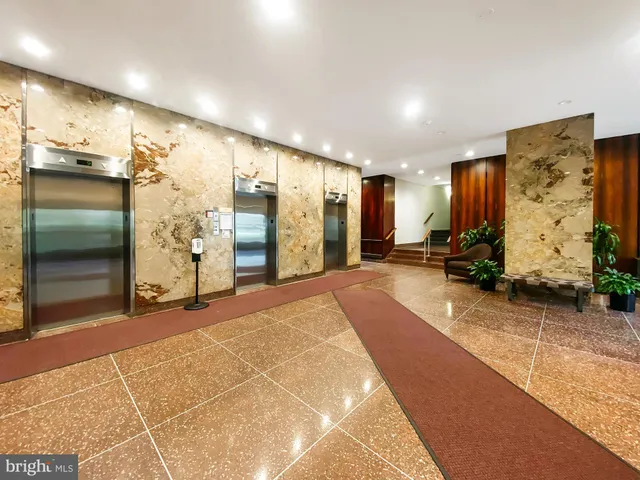 a view of a hallway with stairs