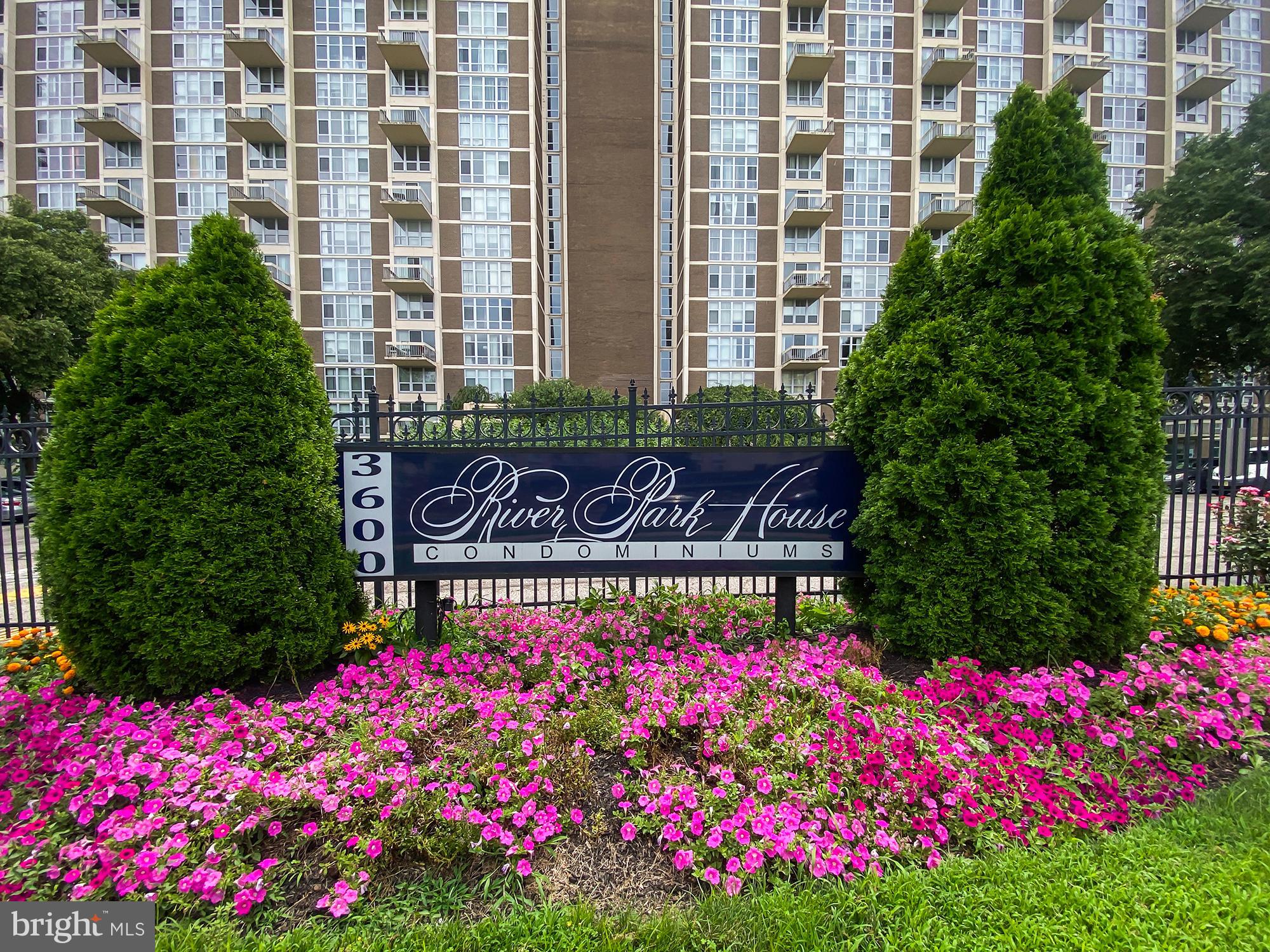 3600 Conshohocken Avenue, Unit 909 Philadelphia, PA 19131 - Photo 19 of 22 a street sign in front of flowers