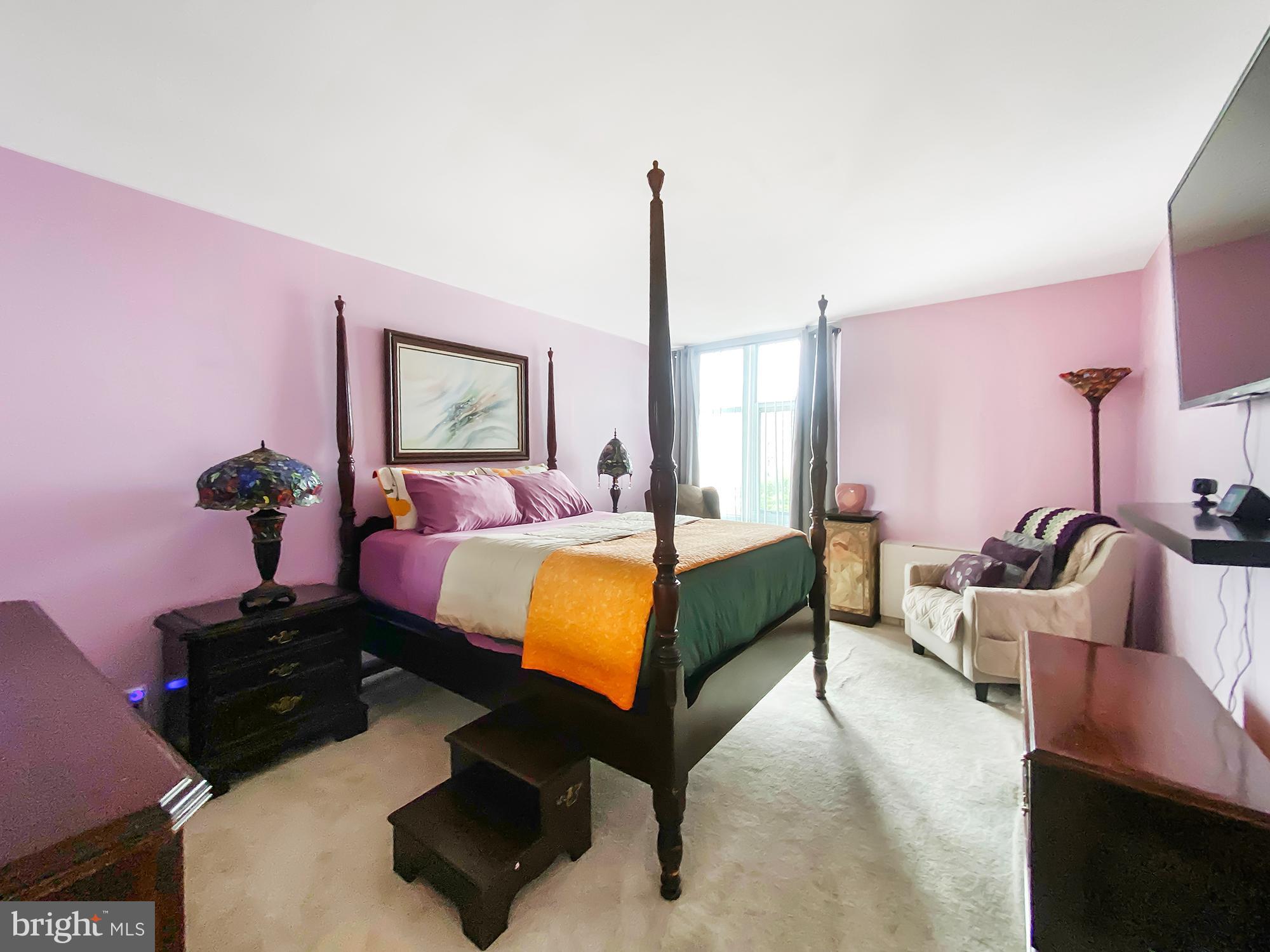 3600 Conshohocken Avenue, Unit 909 Philadelphia, PA 19131 - Photo 4 of 22 a bedroom with a bed window and couch