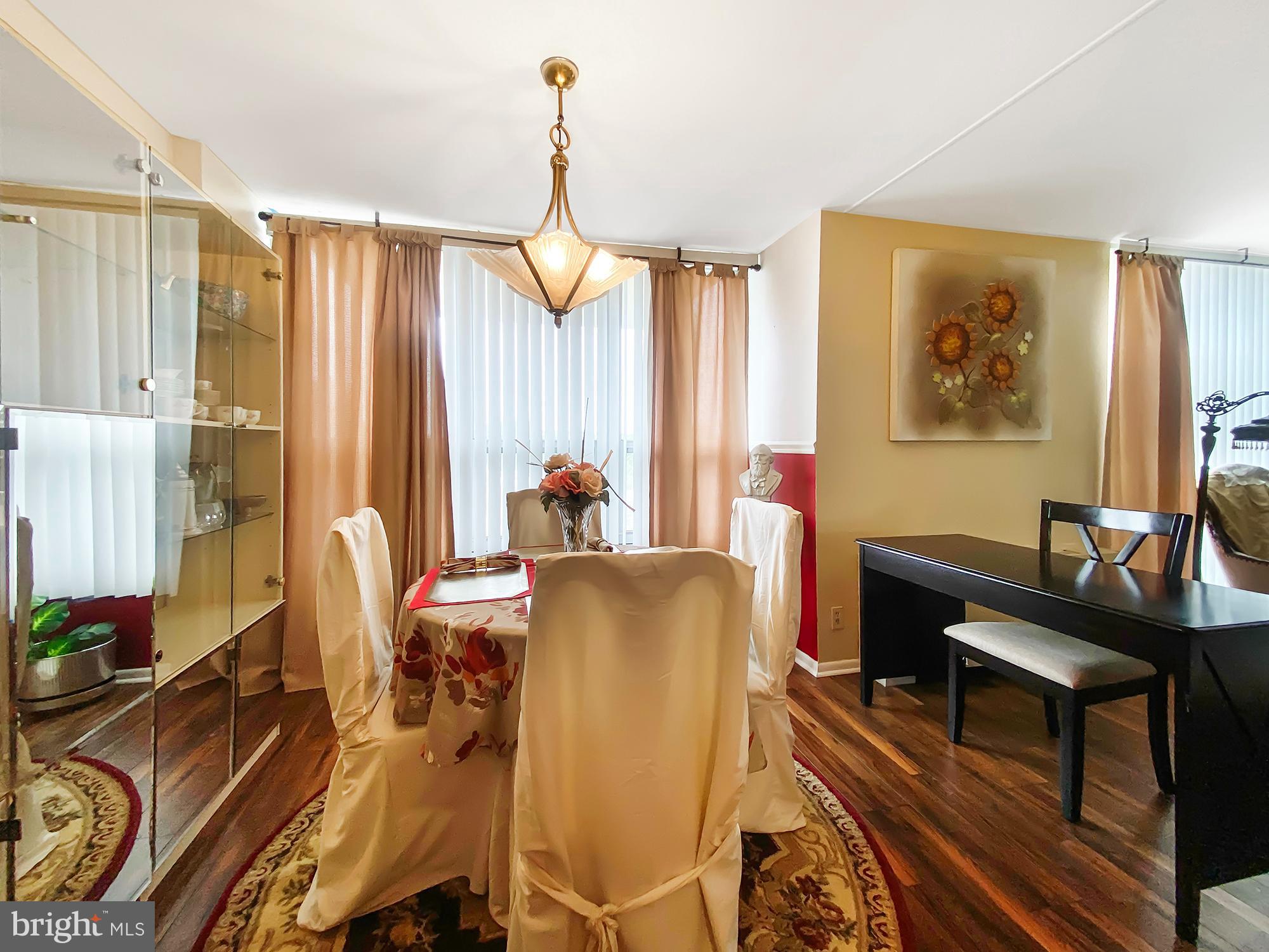 3600 Conshohocken Avenue, Unit 909 Philadelphia, PA 19131 - Photo 7 of 22 a dining room with furniture and a window