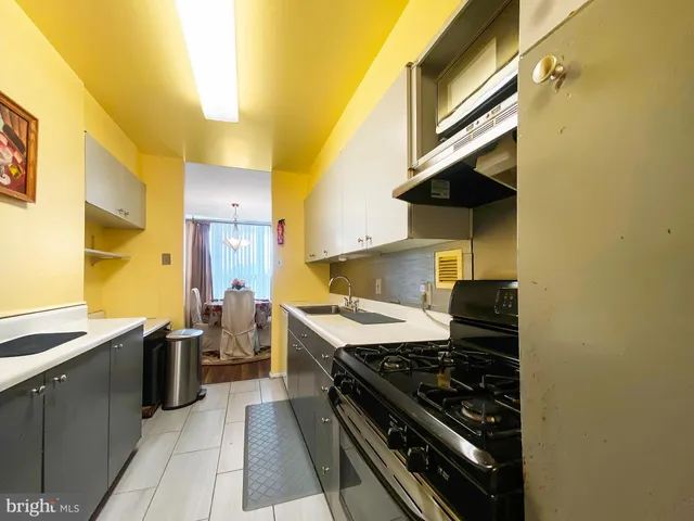 a kitchen with a stove and a sink
