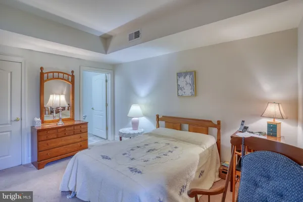 a bedroom with bed and window