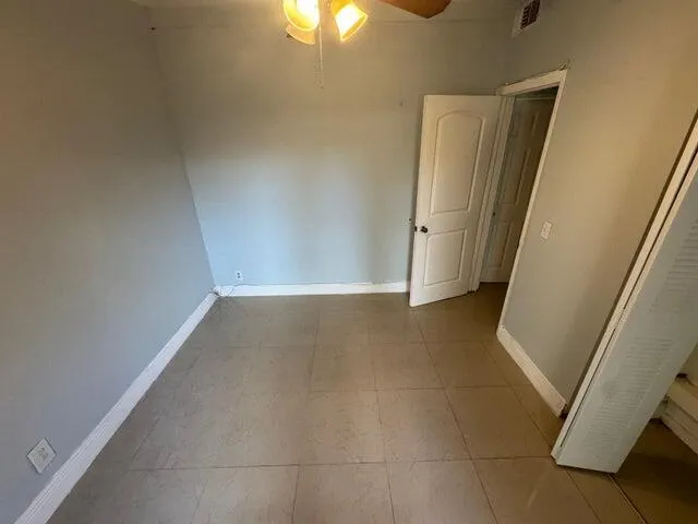 a view of an empty room with a window