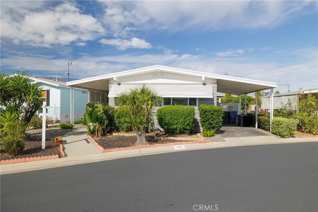 a view of a patio with a table and chairs under an umbrella