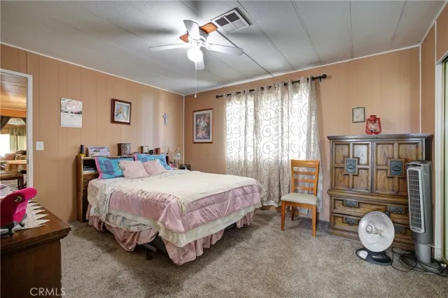 a view of a livingroom with furniture and a window