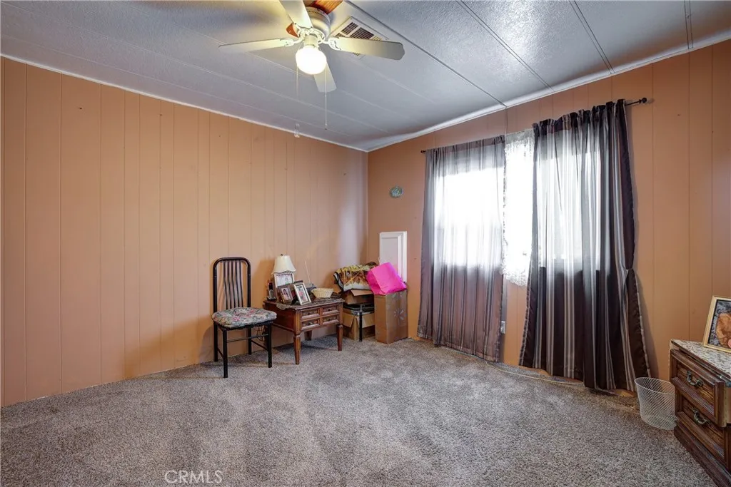 3700 Buchanan Street, Unit 105 Riverside, CA 92503 - Photo 19 of 30 a view of a livingroom with furniture and a window