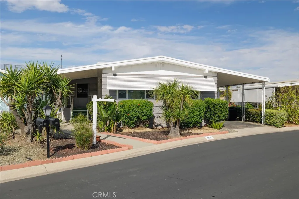 3700 Buchanan Street, Unit 105 Riverside, CA 92503 - Photo 2 of 30 a front view of a house with yard and glass windows