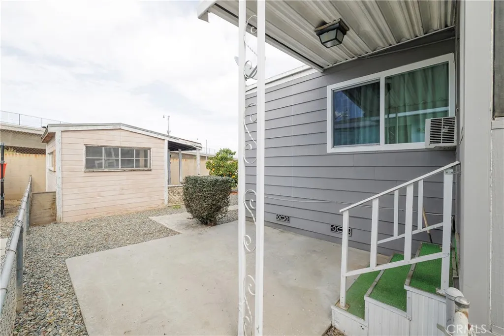 3700 Buchanan Street, Unit 105 Riverside, CA 92503 - Photo 24 of 30 a view of a house with a large window and wooden fence