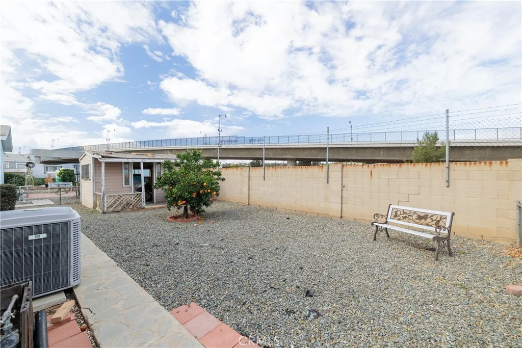 3700 Buchanan Street, Unit 105 Riverside, CA 92503 - Photo 27 of 30 a view of house with lake and outdoor space
