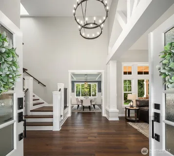 a view of an entryway with wooden floor