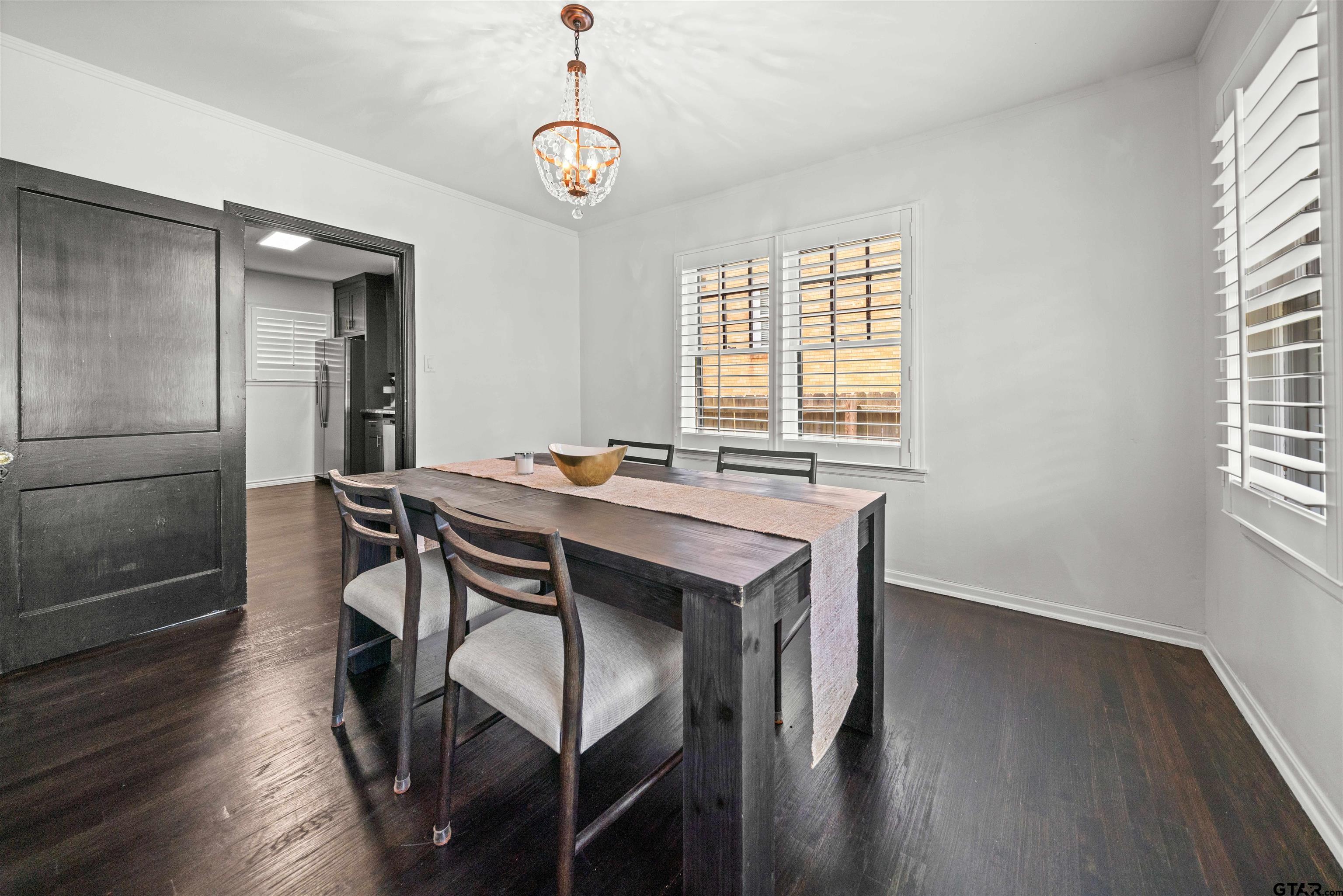 400 Lindsey Lane Tyler, TX 75701 - Photo 12 of 25 a view of a dining room with furniture window and wooden floor