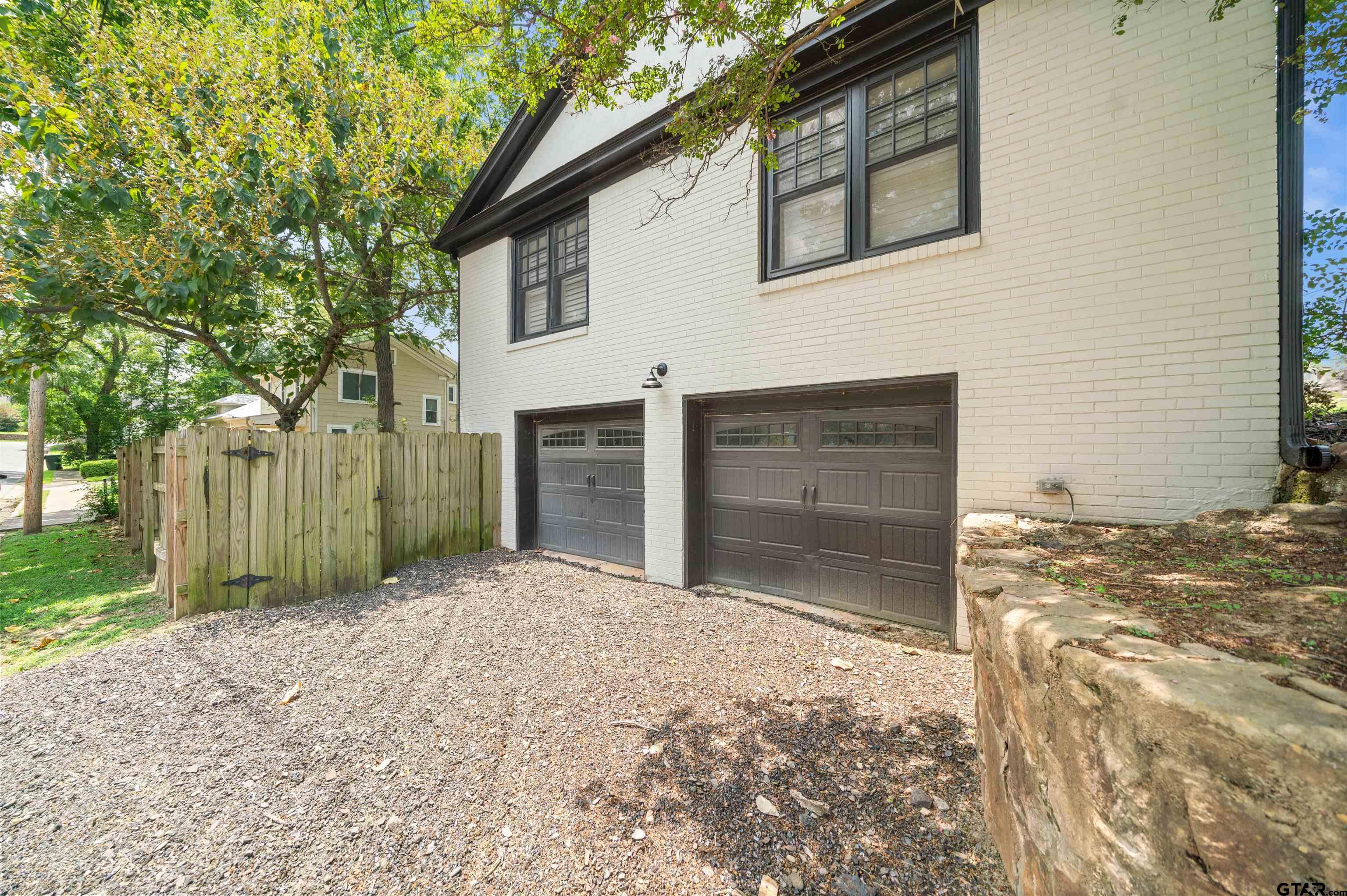 400 Lindsey Lane Tyler, TX 75701 - Photo 21 of 25 a front view of a house with a yard