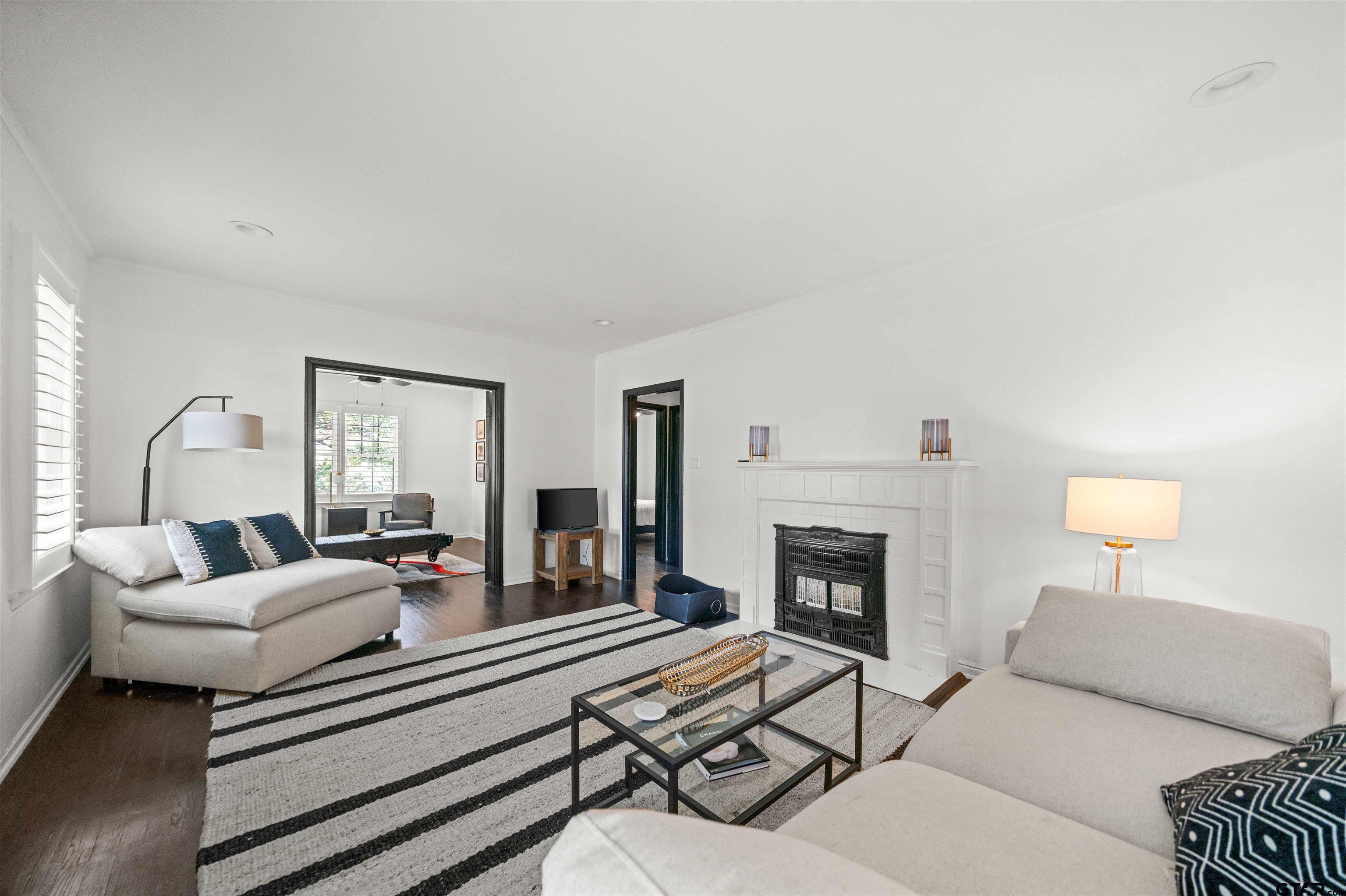 400 Lindsey Lane Tyler, TX 75701 - Photo 4 of 25 a living room with furniture and a fireplace