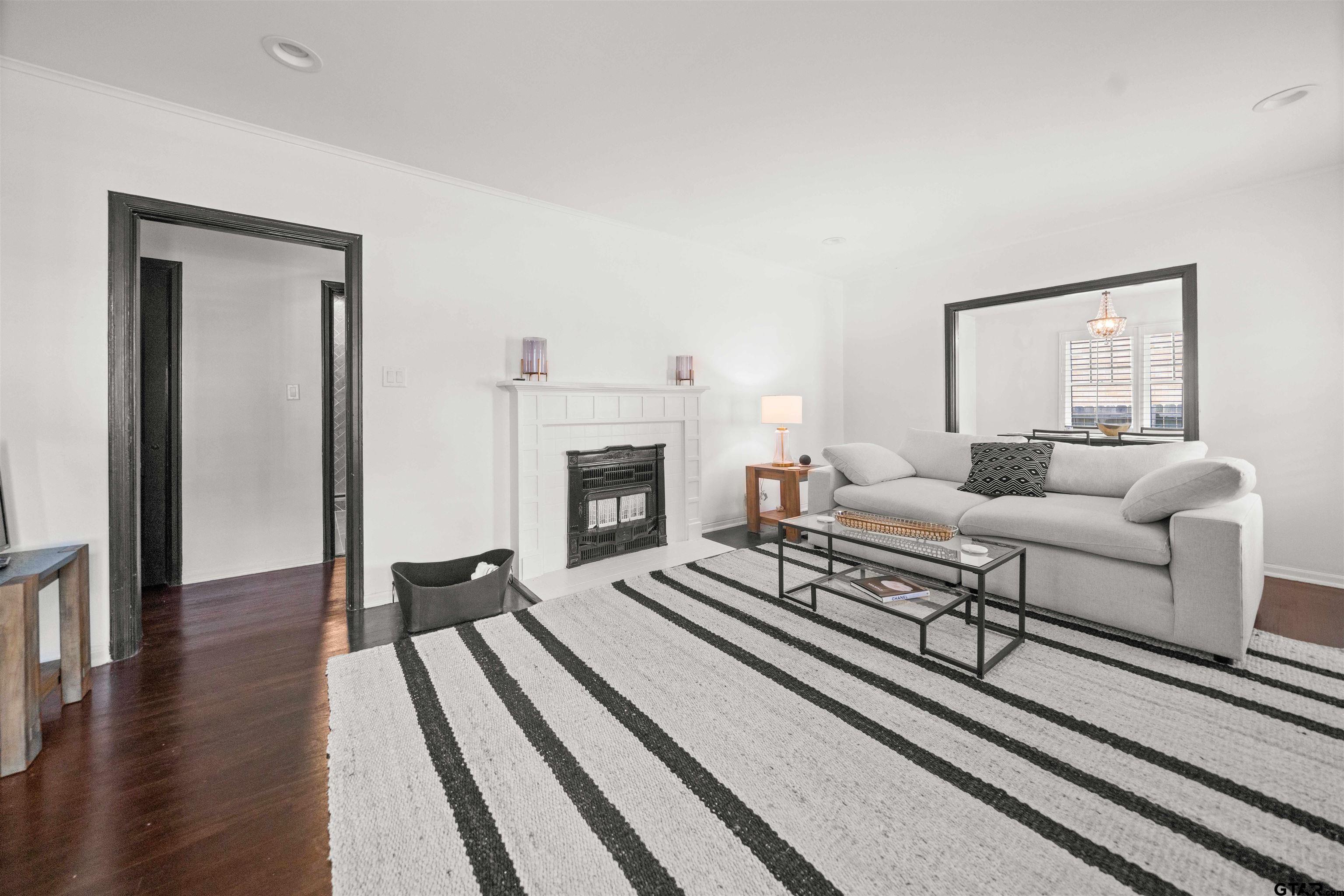 400 Lindsey Lane Tyler, TX 75701 - Photo 5 of 25 a living room with furniture and a fireplace