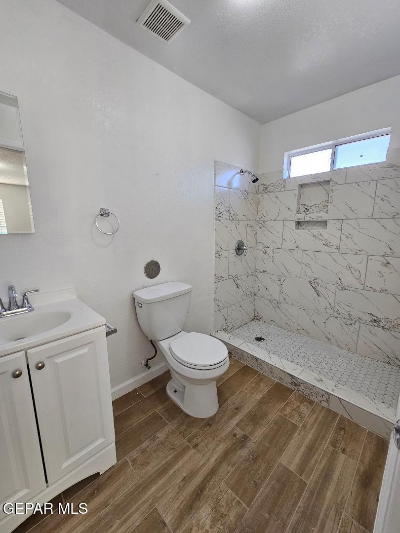 401 South 5th Street Anthony, TX 79821 - Photo 20 of 26 a bathroom with a toilet a sink and shower