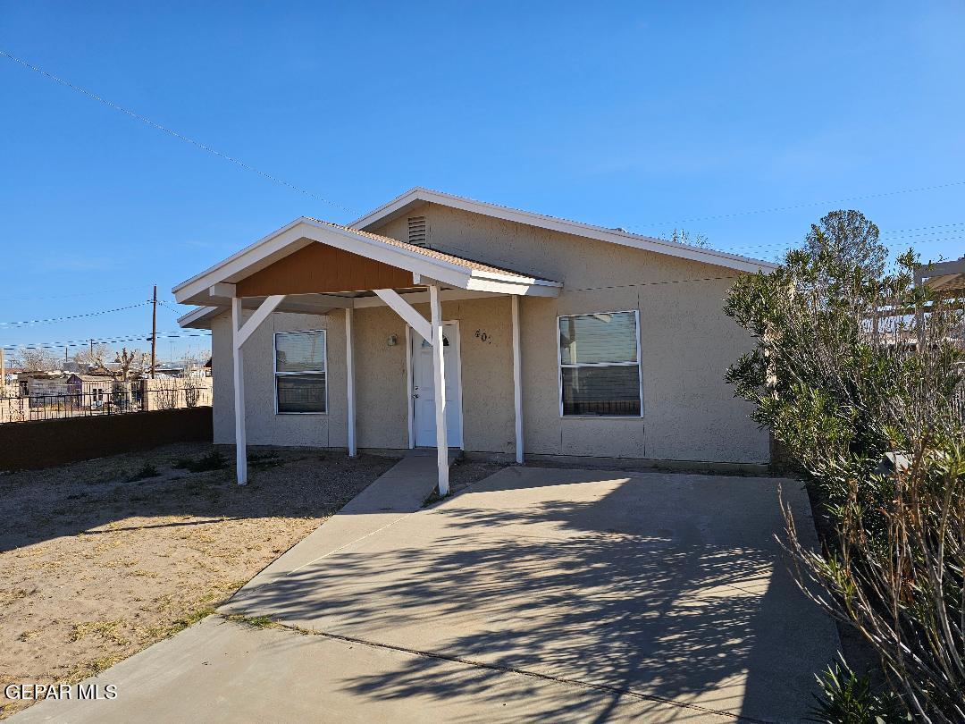 401 South 5th Street Anthony, TX 79821 - Photo 2 of 26 a front view of a house with a yard