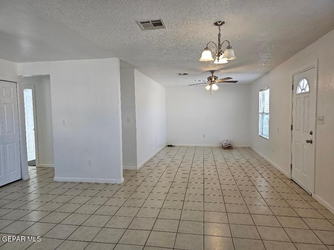 401 South 5th Street Anthony, TX 79821 - Photo 4 of 26 wooden floor in an empty room with a window