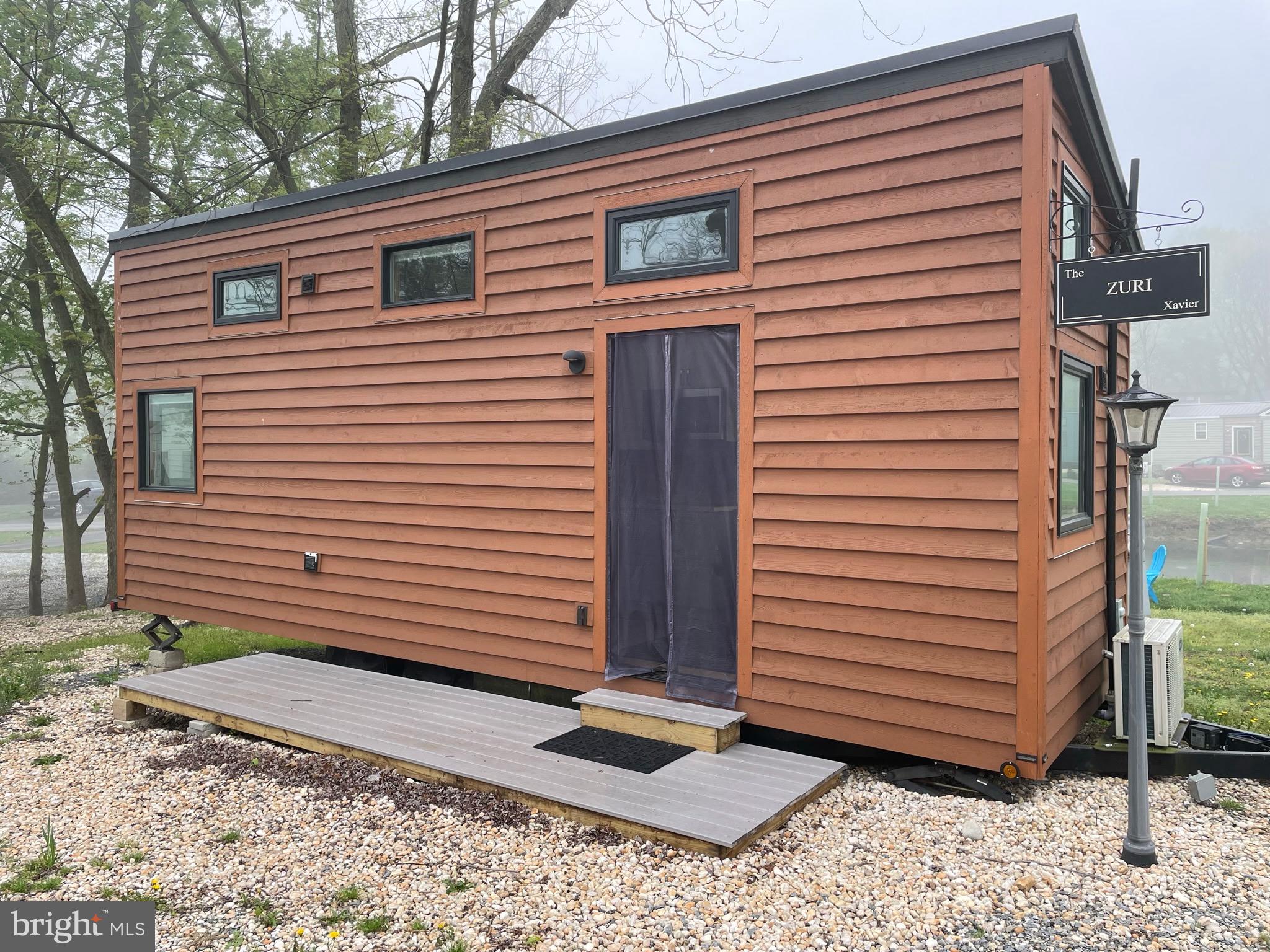a view of a house with a yard and garage