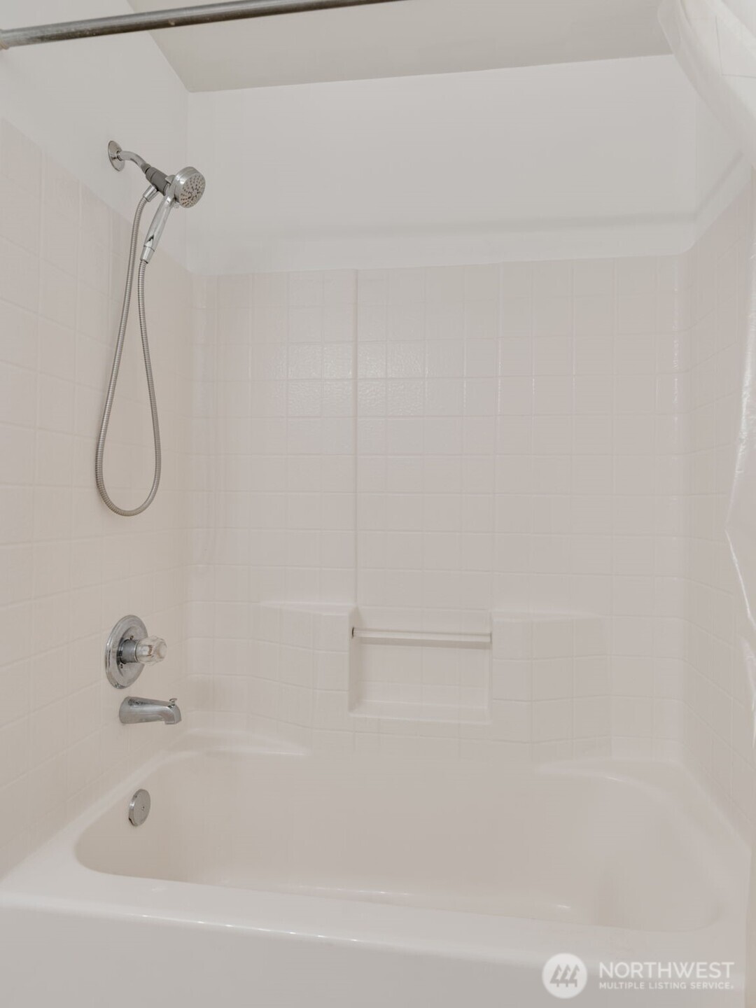805 Harrington Place Southeast, Unit 3143 Renton, WA 98058 - Photo 11 of 25 a bathroom with a bath tub with a shower