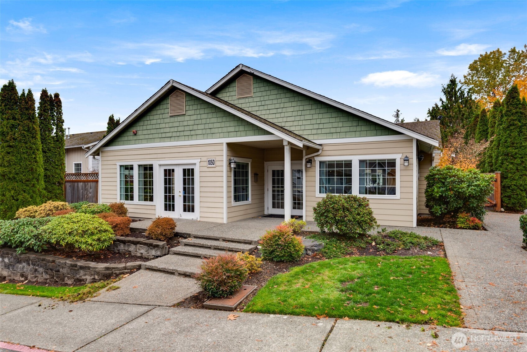 805 Harrington Place Southeast, Unit 3143 Renton, WA 98058 - Photo 19 of 25 a front view of a house with garden