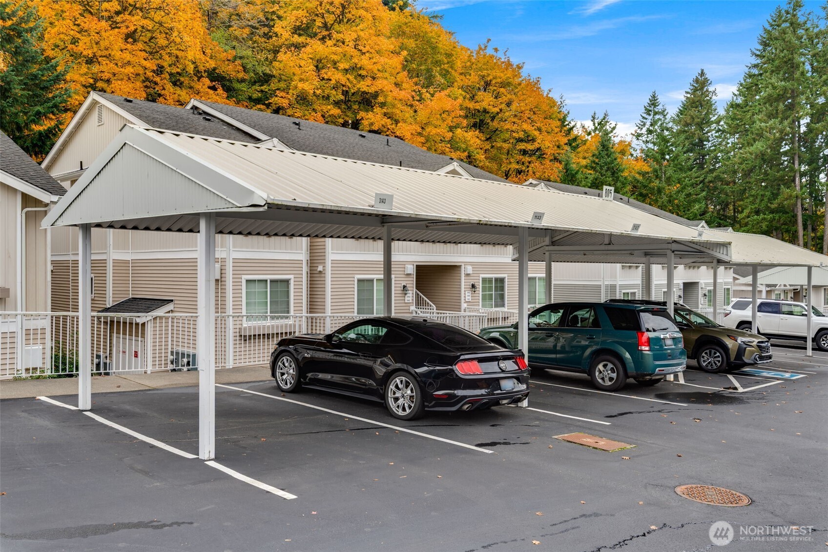 805 Harrington Place Southeast, Unit 3143 Renton, WA 98058 - Photo 23 of 25 a view of a car parked in front of a house