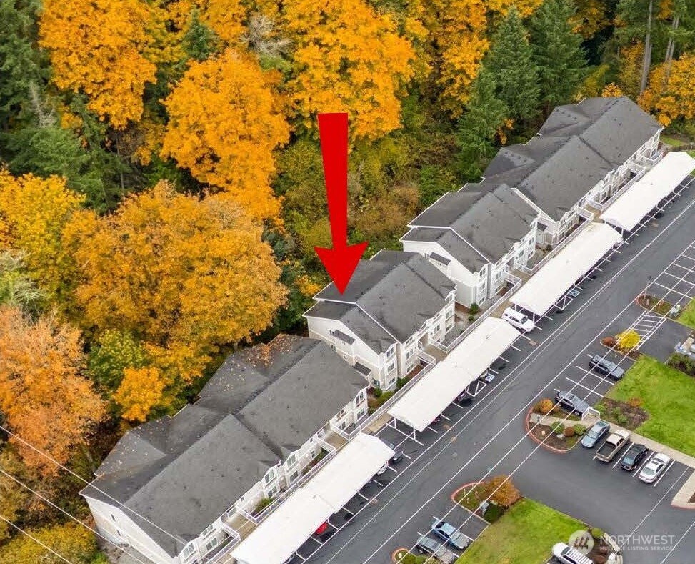 805 Harrington Place Southeast, Unit 3143 Renton, WA 98058 - Photo 24 of 25 an aerial view of a house with a yard
