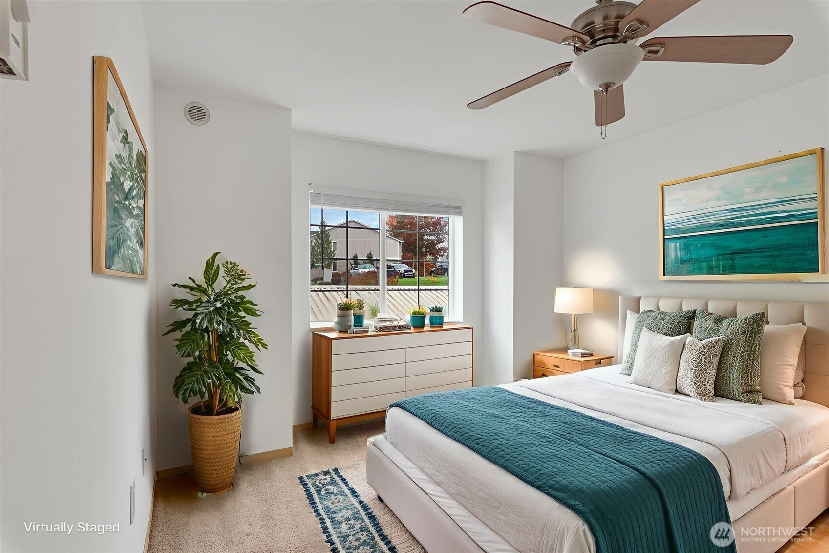 805 Harrington Place Southeast, Unit 3143 Renton, WA 98058 - Photo 6 of 25 a bedroom with a bed and a potted plant