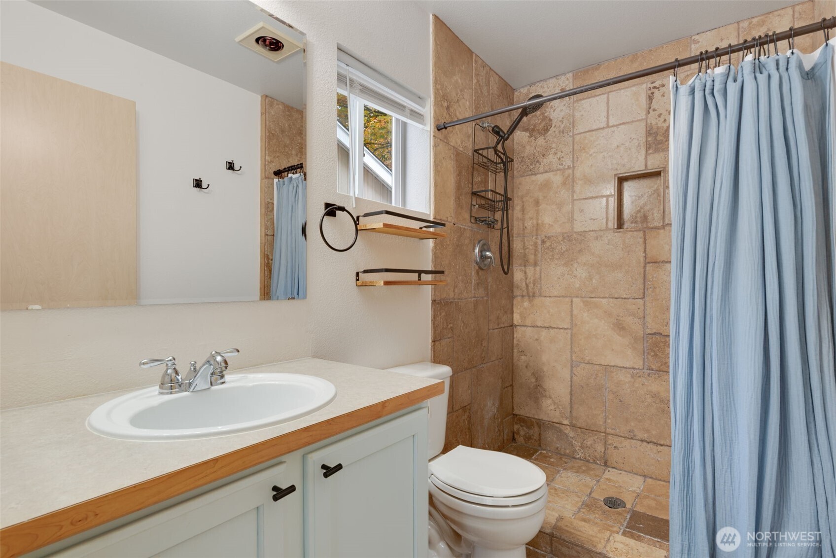805 Harrington Place Southeast, Unit 3143 Renton, WA 98058 - Photo 8 of 25 a bathroom with a sink toilet a mirror and shower