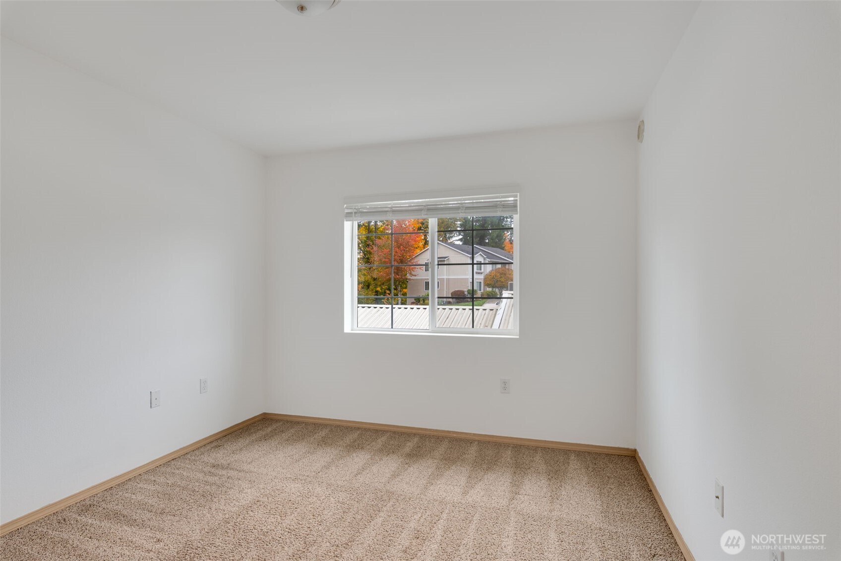 805 Harrington Place Southeast, Unit 3143 Renton, WA 98058 - Photo 9 of 25 an empty room with a window