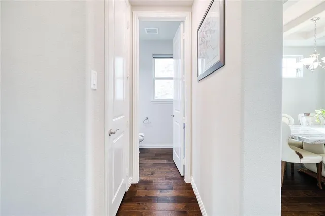 a view of a bathroom from a hallway