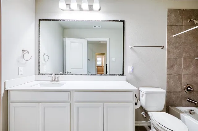 a bathroom with a sink and a toilet
