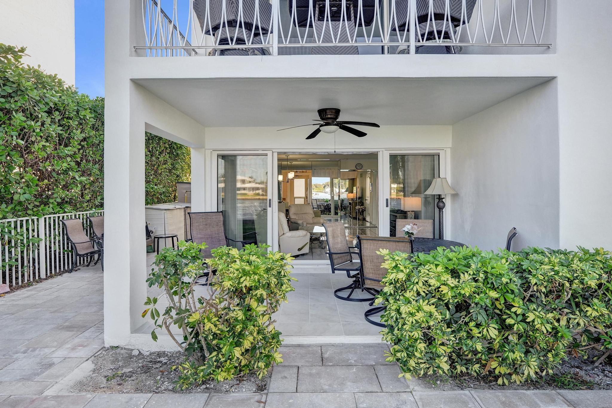 505 North Riverside Drive, Unit 7 Pompano Beach, FL 33062 - Photo 18 of 43 a view of a porch with chairs and plants in front of main door