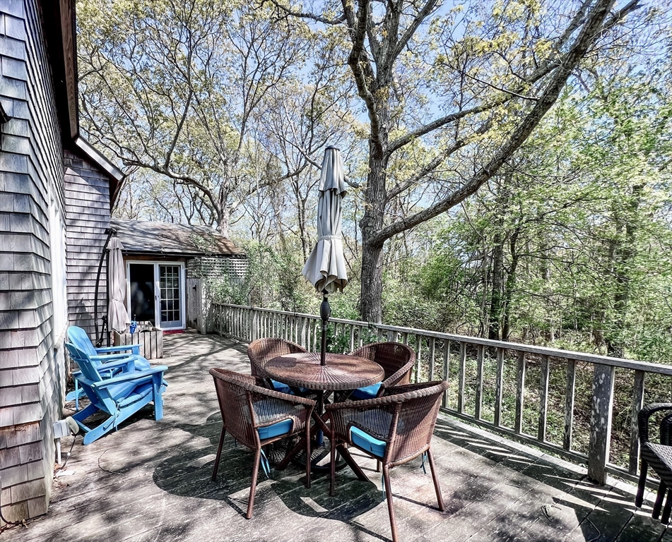 225 Lamberts Cove Road West Tisbury, MA 02568 - Photo 30 of 33 a view of a dinning table and chairs in the roof deck