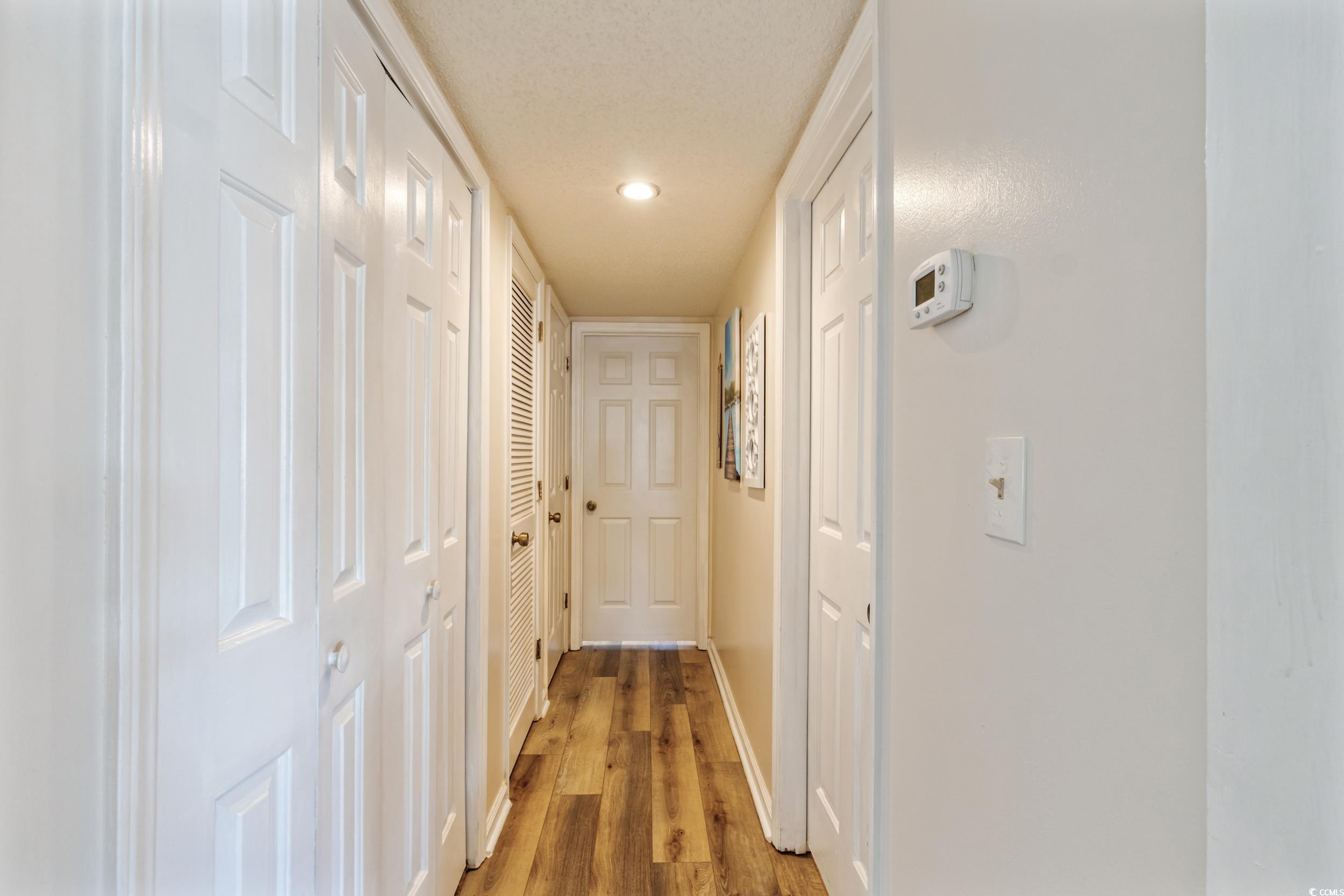 4242 Pinehurst Circle, Unit N3 Little River, SC 29566 - Photo 16 of 30 Hall featuring wood finished floors and recessed lighting