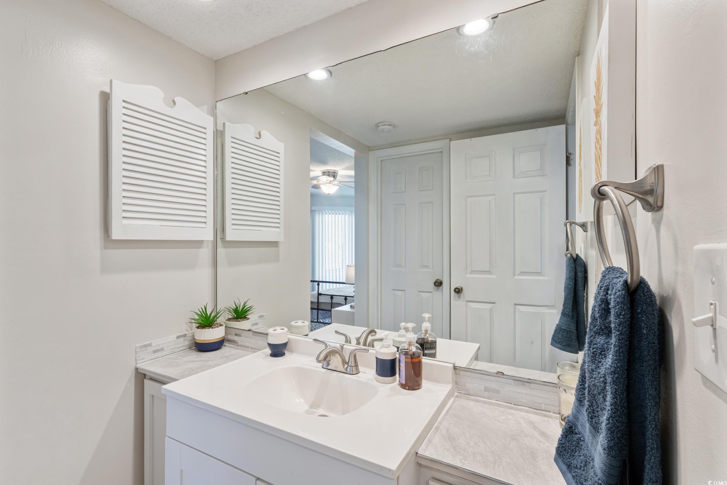 4242 Pinehurst Circle, Unit N3 Little River, SC 29566 - Photo 18 of 30 Bathroom with vanity, a ceiling fan, and recessed lighting