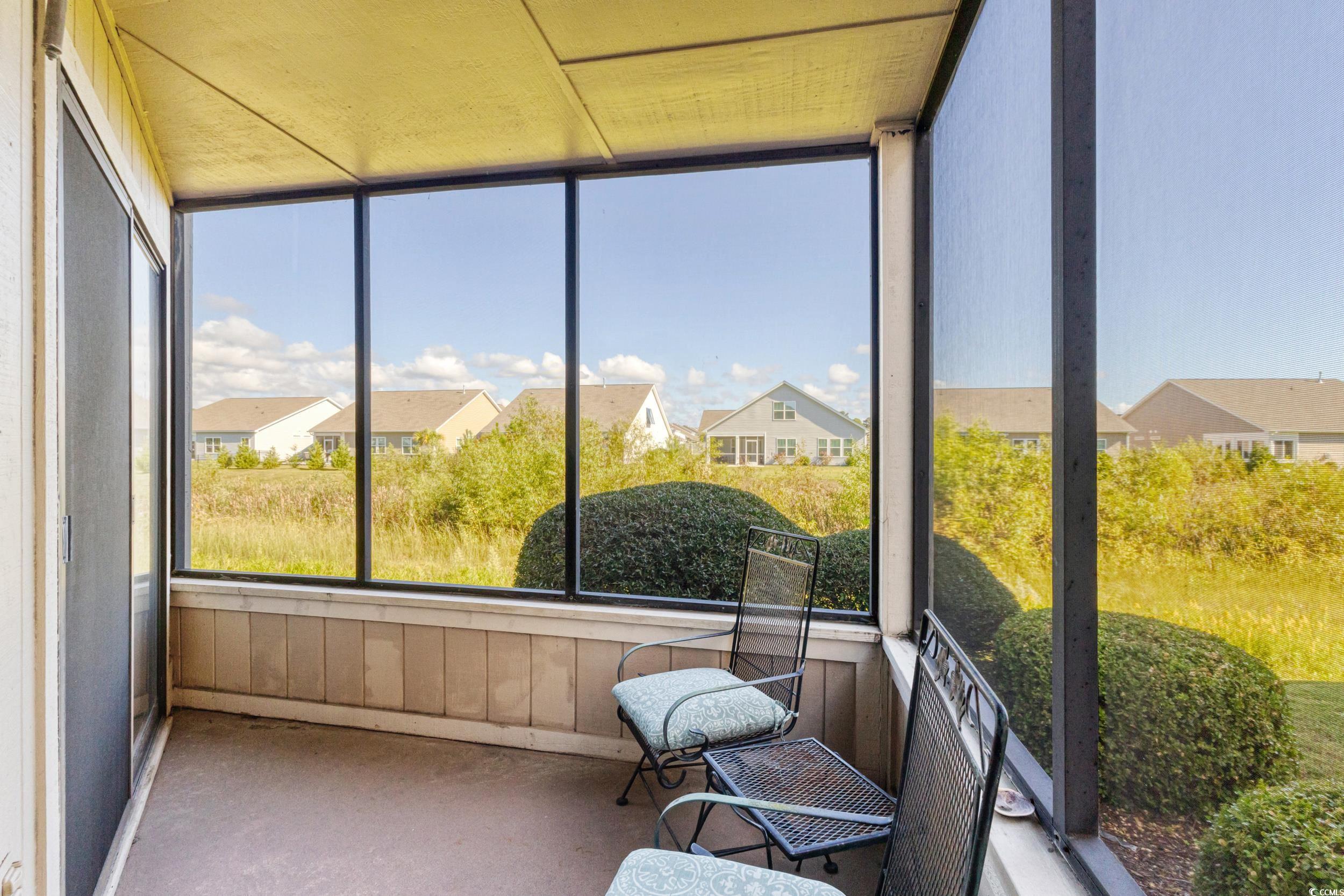 4242 Pinehurst Circle, Unit N3 Little River, SC 29566 - Photo 22 of 30 Sunroom with a residential view