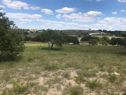 178 Jacobs Crossing, Unit 24 Blanco, TX 78606 - Photo 4 of 9 a view of a lake with houses
