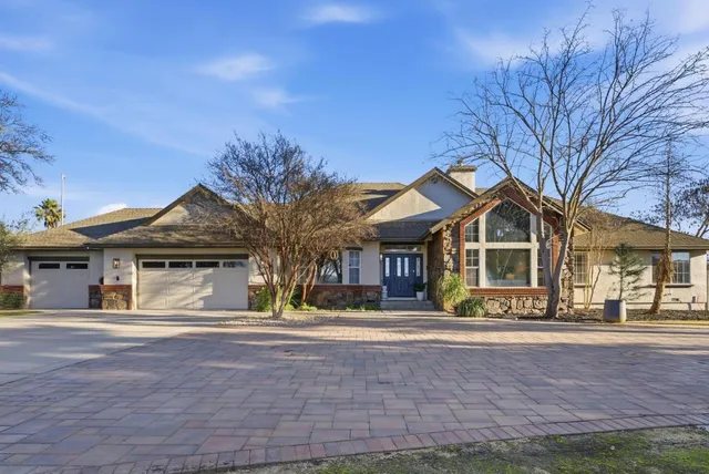 front view of a house with a trees