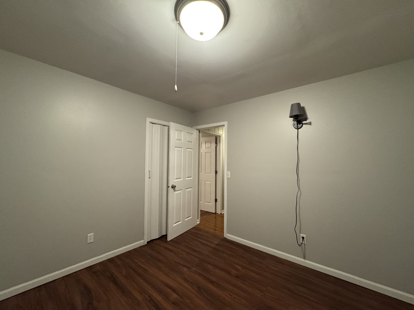 910 West Kennedy Road Braidwood, IL 60408 - Photo 13 of 23 an empty room with wooden floor and windows