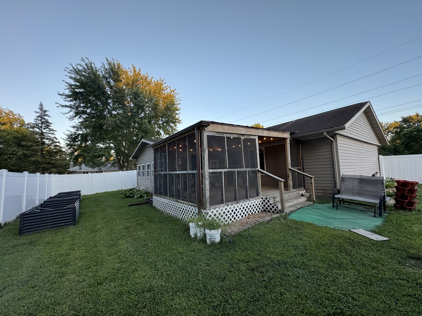 910 West Kennedy Road Braidwood, IL 60408 - Photo 21 of 23 a view of a backyard with a small cabin